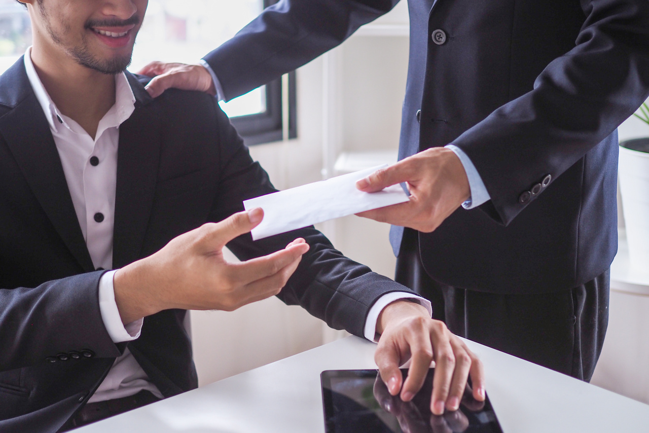 Manager Giving Envelope of compensation to Employee